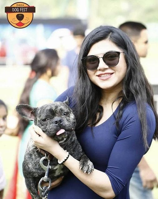 Pet parent with her French Bulldog at a past Dog Fest
