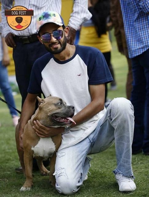 Pet parent with his dog at a past Dog Fest